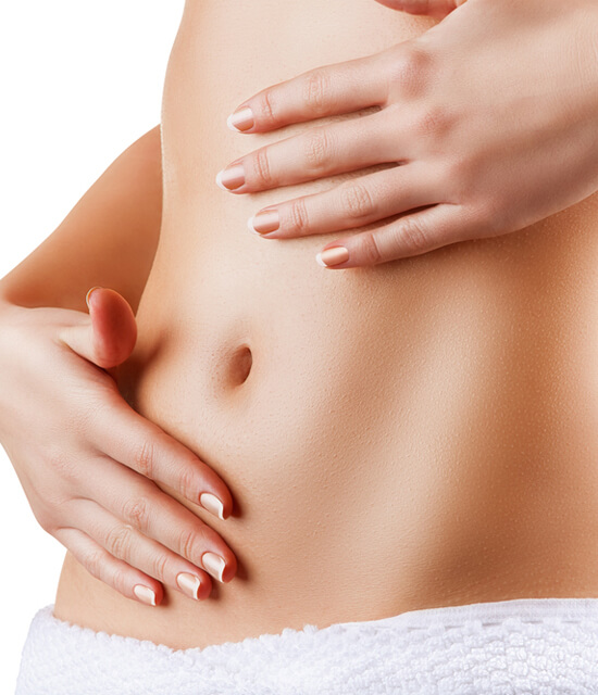 Woman touching flat stomach after CoolSculpting treatment body contouring fat reduction smooth skin aesthetic results
