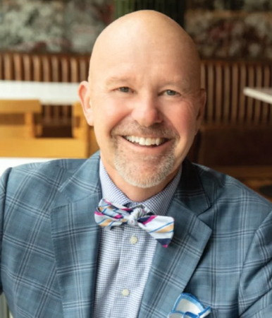 head shot of Dr Burns smiling